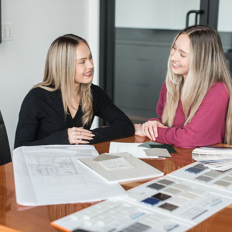 park ridge homes our story chloe and rachel discussing plans